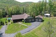 Exceptional 5, 000+ sqft, custom-designed ranch on 6+ acres nestled in the Catskills, featuring 5 BD/4.5 bath, home office/gym, & pool. An entertainer&rsquo;s dream complete with cherry wood floors, granite counters, handcrafted stonework, custom chef&rsquo;s kitchen, & abundant closets. Enter into sun-filled open concept great room, kitchen, & dining room with cathedral ceilings, stone fireplace, & sliding doors to wrap-around deck. 1st floor Primary bedroom suite complete with fireplace, WIC, & jacuzzi tub.   Lower level has large entertaining space with wet bar. Outdoor private oasis has stunning views, heated saltwater pool w/ remote automation, hot tub, blue stone patio & fire pit, 4-car attached garage, generator, & large storage shed.   Property includes pond & cleared hiking trail for private access to world-class fishing on Willowemac Creek. Off property, discover hiking, boating, skiing, snowmobiling, golf, restaurants, breweries, live music, Bethel Woods, Woodstock Museum, & theaters