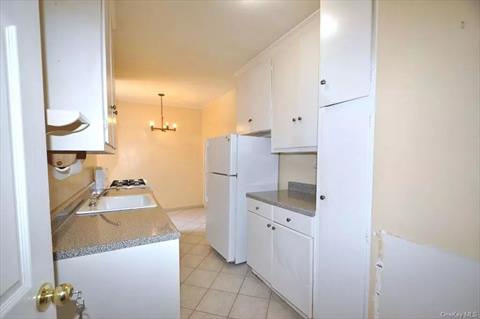 Eat-in Kitchen has plenty of cabinetry and counter space.