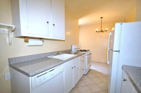 Eat-in Kitchen has plenty of cabinetry and counter space.