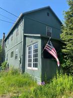 A Paradise Farmhouse on a beautiful oasis of 7+ acres of unique, perfectly balanced field and forest on Black Brook with a stream, pond and large garden. This 4 BR 2 ? BTH has two screen rooms, a court yard and lots of deck. This gem of a home is just up the block from the Forestburgh Playhouse and near Bethel Woods, the Resorts Casino, Indoor water-park and Holiday Ski Mountain. Updated Old out buildings include: The Old Plan Road Toll House Barn, Chicken Coop, Pig Barn, Cut House and Out House. BONUS: Bring your in-laws or guests to the 3-season Mobil Home Coach with direct water, sewer and Italian ceramic tile walk-in shower with window view and additional outdoor shower! The main house has your own personal Spa with a Sauna, a double Jacuzzi and a single Jacuzzi. The property has a Christmas tree farm and a Spring Surprise of One full Acre of every variety of Incredible Daffodils! 7.11 acres of Sunny, Peace and Tranquility. This will be your own Shangri-la-di-da Valley!