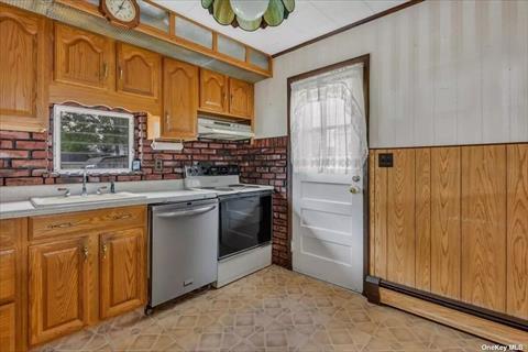 Kitchen has outside entrance to backyard