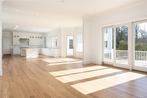 Virtually staged breakfast area overlooking kitchen and beautiful backyard.