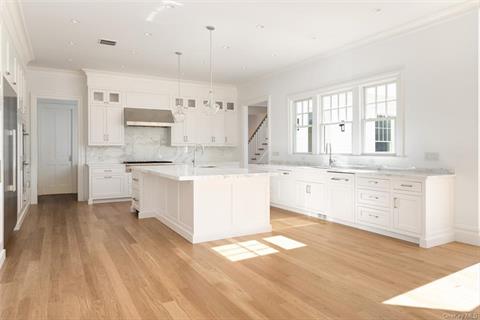 Impressive entry with white oak floors and over 10 foot ceilings