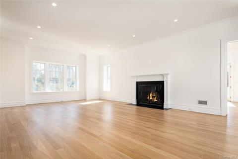 Chefs will flock to the open kitchen where beautiful custom cabinetry surround a massive island/breakfast bar.