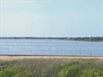 Bay Mor on the Bay - First level beautifully renovated one bedroom condo overlooking the Bay. Watch the sun set from the back deck. This tastefully updated unit features a full size washer dryer, 2 a/c units, 2 flat screen TVs, fully equipped kitchen and linens. Close proximity to the heart of the village of Westhampton Beach. Ocean access across the street. Hang your hat here and enjoy all that the Hamptons have to offer. Available 2025: May $5, 500; September 4-30 $6, 500; October $5, 500.