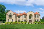 Experience the grandeur of this exquisite, newly constructed 11-bedroom contemporary colonial brick mansion totaling 14, 835 sq ft of living space spread over 4 levels in Back Lawrence, on a lot just shy of an acre. Every detail of this home showcases the highest level of craftsmanship and design. There are 13 radiant heat zones, 8 HVAC and full house generator. As you step inside, you are greeted by a breathtaking two-story center hall adorned with a dazzling Swarovski crystal chandelier. The main floor encompasses luxurious living room with fireplace, an elegant formal dining room, a stately family room with fireplace along with 3 Andersen doors leading onto a 1600 square foot patio, a formal library, plus an ensuite guest bedroom and a 3 car heated garage. Prepare to be amazed by a huge designer kitchen, featuring two stunning granite-topped islands, butler pantry, four top-of-the-line Wolf ovens, three sinks and two Miele dishwashers. With four Subzero refrigerators, this kitchen is equipped to meet the needs of even the most discerning professional chef. Ascend the grand staircase to the second floor, where six spacious bedrooms await, boasting high ceilings and impressive architectural details. Your own private oasis awaits in the master bedroom, complete with a generous sitting area, 4 walk-in closets, and a magnificent bathroom with modern Bain Ultra Whirlpool. On the third floor, you will discover four additional bedrooms and two full bathrooms, providing ample space for family and guests. An elevator services all 4 floors. The lower level of this masterpiece home offers a pleasant surprise with its nine-foot ceilings. A custom-built walnut bar takes center stage in an expansive and elegant entertainment area with a theater, billiard room and gym, perfect for hosting memorable gatherings. Let this be the home of your dreams, where you can create beautiful and lasting family memories! Close to many houses of worship!