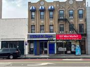 Excellent investment mixed use 3 story building ,  store plus 2 apartments fully occupied and a finished basement , excellent income 6.9% Cap Rate , very busy commercial area on Northern Blvd and 108th Street , close major highway .