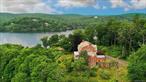 Elegant spacious Georgian-style brick home, designed by renowned architect William A. Bates for the Herbert C. Pell family in 1892. Located on a quiet hilltop Tower Hill Loop, all four levels offer world class views of beautiful Tuxedo Lake. Welcoming entry through a center stair hall, the main floor features an exceptionally large beautiful living room and equally spacious paneled dining room with high ceilings. The living room&rsquo;s two Jefferson windows seasonally bring the outdoors in and offer access to a large, pillared porch overlooking the lake and terraced garden area below. The dining room also accesses the porch, and the large picture window provides an ever-changing view of the lake. Off the center hall are a generous warm and detailed library and well-appointed galley kitchen. The second floor comprises five bedrooms each adjoining full baths. The upper third floor is a capacious partially finished area with lake views that could easily be restored for additional bedrooms or other living space. The large open plan lower level is a large family or entertainment room, and has a kitchen, full bath, multiple closets, and office study with adjoining wine cellar. All opens onto a large stone-enclosed outside room that opens to the terraced gardens and play area. Private and historic Tuxedo Park is a small 24/7 gated police-guarded community within an hour&rsquo;s drive of mid-town Manhattan. The village provides swimming, boating, biking, fishing and hiking as well as cross-country skiing and other outdoor activities at your doorstep.