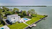 JULY 15th THRU LABOR DAY IN THE HAMPTONS! $75, 000. An amazing waterfront property, this beautifully maintained home features open bay views; heated inground pool; private dock, a first floor primary suite and a second ensuite bedroom; 3 additional guest bedrooms; 3.5 bathrooms; bi-level decks; well equipped kitchen; formal dining room; breakfast nook; Guest Quarters w/a separate entrance & summer kitchen; and an attached 2-car garage. Tastefully furnished, this home is ideal as a luxurious residence. Minutes to ocean and bay beaches, marinas, fine dining, boutiques, galleries, iconic golf courses, fishing grounds, shopping malls, vineyards and all The Hamptons has to offer. Pets upon review. Tenants responsible for Utilities and maintenance. ENJOY Farm & Vineyard Events - and all the Splendor of Summer in The Hamptons! $75, 000 from July 15th through Labor Day.