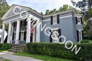 This prominent Greek Revival residence stands in testament to fine 19th century architecture. First built c. 1830 with addition in 1850, the majestic temple front greets and graces an expansive portico. The front sidewalk lures from the heart of the charming and bustling Village of Rhinebeck. Detached and generous two car garage includes an upper level for storage and/or potential studio or workshop. Two additional sheds and carport. The landscaped property includes a secret garden and space for simple enjoyment. Solid construction with meticulously placed fieldstone foundation. Cement floor basement with log posts accessible from interior and Bilco doors. Period craftsmanship and architectural detail throughout. If your preference is historic charm updated to your own tastes and needs, this 19th century diamond awaits! 2.5 miles to Rhinecliff train with Amtrak to Penn. 90 miles to NYC. More pics to come!