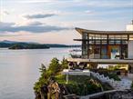 A modern-day tour-de-force, this epic Hudson River showplace shares its remarkable waterfront setting with a guest house, sculpture garden, collector&rsquo;s garage, and 5-star amenities that transcend the ordinary. In the heart of the Hudson Valley, this enchanting estate is one of the few properties to stand directly on the Hudson River&rsquo;s shores. And it rests on a private peninsula embraced by the sparkling river and majestic surroundings. Seemingly floating above the water, the dazzling 5-bedroom residence and its matching 2-bedroom guesthouse take architectural design to a new level. Radiating sophistication, the home&rsquo;s vast glass walls open to expansive terraces over the river while soaring ceilings and rare wood, marble, and stone create an unforgettable backdrop for luxury living. In addition to stunning indoor and outdoor pools, you&rsquo;ll enjoy a gym, theater, fire pit, spa, outdoor kitchen, dock, and a private helipad. Located close to Rhinebeck, New York City is only 2 hours away.