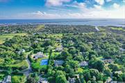 In the vibrant heart of Westhampton Beach Village, find a residence where post-modern design dances harmoniously with luxurious refinement. Resting on a generous .92-acre expanse, this home stretches across an impressive 5, 400 square feet, enveloped in superior finishes and vast living spaces and is just 1.5 mile from Dune Road. Every step within reveals open spaces and privacy alike. The sun-drenched living room with expansive ceilings feels bright and grand, courtesy of its prime south-facing alignment. The radiance emanating throughout accentuates the inherent charm and sophistication of the space. Six spacious bedrooms serve as personal retreats, each offering the flexibility to cater to every familial need. A modern yet classic eat-in kitchen beckons culinary adventures, seamlessly blending functionality with style including Wolf and Sub-Zero appliances. Adjacently, the all-weather room stands as a beacon for relaxation, ensuring enjoyment across seasons. Journey to the 1, 400 square foot lower level not included in the home square footage, to unveil a finished basement, with a cozy and well-equipped media room with theater style seating and a Pool Table. This sanctuary promises countless hours of entertainment, bringing cinematic experiences right to your doorstep. The house boasts four lavishly detailed full bathrooms alongside two gracefully appointed half baths, with each space echoing traditional elegance. Central to the home, a fireplace bestows a touch of warmth, setting the stage for intimate gatherings and quiet reflection. Beyond the interiors, the outdoors entices with a heated salt water gunite pool, a beckoning oasis for summer splashes and wintery dips alike. A stylish pool house with half bath and outdoor shower sits ready, ensuring every event becomes a cherished memory. While ensconced in the buzz of Westhampton Beach Village, with its chic boutiques, delectable dining, and lively events, this home offers an enclave of serene privacy and luxury. Step into a world where style, comfort, and grandeur converge. Your refined Hamptons sanctuary awaits. Close to places of worship.