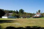How would you like the opportunity to own 70 acres of beautiful open pastures, lined with soaring Pines, numerous fruit trees, and a stream, all located less than 5 minutes from both the Yo1 Health Resort & Spa and the quaint hamlet of Hurleyville with multiple restaurants, theater, shops, the beautiful rail trail and so much more all in your back yard! This meticulously maintained property offers almost 1600 feet of road frontage, a large barn with water and electricity, a paved driveway, a generator hookup along with a portable generator,  new above-ground oil tanks with a shed enclosure, and we haven&rsquo;t even begun to discuss the inside of this expansive home. Massive, bright open concept plan in the kitchen & living room with high ceilings, 3 Full baths sheathed in tile, hardwood floors, beautiful views from every window, large bedroom on the main floor, three bedrooms on the second floor, a full-sized walkup attic can very quickly be turned into an additional study or bedroom and a full finished walkout basement with guest quarters including a nice sized second kitchen, living room, bedroom, pantry and huge bathroom. There is so much space your guests will not want to leave! Properties of this size and condition in this highly sought-after location with the best Sullivan County has to offer are rare to come by. Less than two hours to NYC Additional Information: Amenities:Guest Quarters, HeatingFuel:Oil Above Ground,