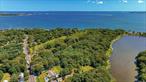 Generous 2+ acre building lot in popular East Marion close to area beaches, parks and moments to Greenport for shopping and restaurants. Build your dream home here and capture possible bay view. Survey available illustrating parcel #1. This lot is a final subdivision located in R40/1 acre zone and can not be further subdivided.