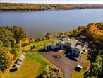 A Private Oasis nestled in the charming hamlet of Ulster County NY on -7 acres with river frontage and direct access to your private dock. This home is Perfectly situated along the western banks of the Hudson valley, approximately 80 miles north of New York city, making it accessible to both city dwellers and those looking for a quieter, riverside community. This distinctive contemporary tri-level residence is perfectly tucked away in a secluded enclave. A true riverside oasis and haven of tranquility. The river views from nearly every room create a sense of peace and calm. With the opportunity for a private dock, lush, and landscaped grounds, this is the epitome of riverside living. Discover serenity and natural beauty in this home that rests on the edge of the river. The tranquil views, combined with well-appointed living spaces, create a retreat where you can unwind and recharge. This riverside custom designed solace offers 10, 000 sqft, including 6 bedrooms and 7 baths. The primary bedroom is complete with a dual facing fireplace, large ensuite bathroom, jacuzzi tub with waterfall, built in radio system, gym, sauna and private river view terrace! This home is perfect for entertaining with an exquisite indoor and outdoor dining area, exterior wood burning stove, cabana, inground pool and patio, all overlooking the river. Enjoy the custom cabinetry, built in luxury appliances, wet bar, butlers pantry, cathedral ceilings and more. Every room has a story to tell with its unique contribution. With Perfect proximity to other Hudson valley towns there are many activities and experiences to enjoy. Hiking, fishing, boating, picnicking, community events, culinary delights and all the historical significance the town has to offer. This property presents a compelling opportunity for those seeking to maximize their investment with in-law suite and two bedroom cabana. This property is more than just a place to call home; it&rsquo;s a prime income-generating opportunity. With its exceptional layout, stunning aesthetics, and ideal location, it&rsquo;s perfectly poised to become your lucrative event venue investment. Beyond the aesthetics, this home offers an atmosphere that is impossible to convey through descriptions alone. It&rsquo;s a feeling of comfort, a sense of belonging, and the promise of a brighter future. You&rsquo;ll sense the potential for relaxation, inspiration, and the life you&rsquo;ve always imagined the moment you step foot on this riverside solace. Schedule your private tour today to learn more and take advantage of this extraordinary opportunity.