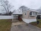 Newly renovated 2 bedroom 1 bath. All new LifeProof flooring throughout. Upgraded electrical and lighting. New kitchen, complete with appliances. Washer and dryer included. This home has a forever Aluminum roof, Vinyl windows and a very unique oversised fenced in yard. Shed makes for a great workshop or storage. Shed also has electrical outlets and lights. Newer oil furnace installed in 2021 New hot water heater. This is a pet friendly non age-restricted community welcome to all! Special bonus! First full month HOA fees paid by seller!! NO application fees for residency. The monthly HOA fees are $1215. This includes property taxes water and sewage. Financing is available for this home!