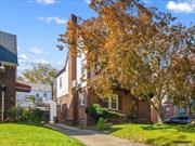 Welcome to the classic charm and contemporary living in this rare 2000-square-foot Tudor house nestled in the heart of Bayside Hills. With 3 bedrooms and 2.5 baths, this spacious home features a living room with a fireplace, a formal dining room with high ceilings and crown molding, and an updated eat-in kitchen. The second floor consists of a master bedroom with Split A/C and 2 additional bedrooms, The finished walk-up attic with a high ceiling can be utilized for storage, play, or work. The fully finished basement, complete with windows and a bathroom, adds versatility to the space. The convenience of a two-car garage and proximity to stores, restaurants, schools, major highways, and public transportation (Q27, Q30, Q31, LIRR). School District #26, including MS74 and Cardozo HS.