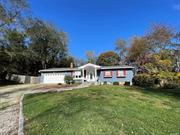 Beautifully updated, 3 bedroom, 2 bath one level home. Sited on .5 acres and centrally located on a private road,  close to South Ferry. This home offers an open floorplan, refinished wood floors throughout, updated bathrooms and an attached 2 car garage with a fenced yard. The primary bedroom and sunroom lead to a rear deck and yard. In addition, there is a large unfinished basement with garage door entrance and utilities. A wonderful property and close to all.