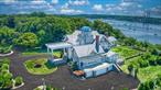An Iconic and historic 1.4 acre Estate set proudly into the distinguished Waterfront Bluffs of Belle Terre. Elevated unobstructed and panoramic Sunset views of Port Jefferson Harbor, Pirates Cove and Long Island Sound. Magnificent 13, 800 Square foot Historic Waterfront Mansion constructed circa 1900. Arrive by fully lighted Driveway into dual Auto Courts and 3 Story Portes-Cocheres covered entrance. 5 Levels of Coastal luxury serviced by 3 Staircases and Elevator. Enter through oversized French Double Doors into a Sun-drenched Cathedral Foyer with Dual Sided Fireplace, Mezzanine Balcony and Side Hall Colonial Ballroom Staircase. Glass French Sliders span the Waterfront West Wall and provide egress to wraparound Blue Stone Deck and Courtyard. Chef&rsquo;s Kitchen with Dual Ranges, Dual Oven, Gas Fired Grill, Viking Professional Series Vented Hood, Oversized 6&rsquo;x24&rsquo; Center Island. Butler&rsquo;s Accessory Bar Room. Harbor-side panoramic Breakfast and Dining Rooms. Swimming Hall with 10 Person Spa and Lap Pool wrapped in Glass sliding French Doors. Mezzanine level includes Calacatta Marble Master Wing and Suite with Deck overlooking the Harbors. Dual Master Fireplaces. 2 Guest Bedrooms with Harbor-side Balconies and Fireplaces. Au Pair&rsquo;s Wing with separate entrance. 3rd story Lounge and Bar with Striking Center Chimney and Panoramic Harbor side Sunset views off Balcony. Accessory Guest Bedroom and Bath. 4th floor Widow&rsquo;s Peak and sweeping 360* domed Glass Observatory provide unrivaled views of the Harbor and Sunset. Finished Basement with Living, Media, Fitness, Sauna and Full Bathroom. 7 Bedroom, 5 Full Bathroom and 2 Half Bathroom. 22 Rooms in total. Granite Foundation, Apron and Retaining Walls. Composite Slate Roof equipped with Ice Cleats. Privately set deep off access road. Moments from Beaches, Golf Course, Country Club, Marina and all the amenities of Port Jefferson Village.