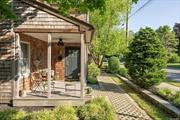 Renovated Greenport Village Farmhouse with custom woodwork details throughout! With a simplified way of living, the location is amazing and the spaces have been uniquely well designed to maximize the use of space and quality craftsmanship. The yard and hardscapes were installed with the designs of coastal village landscape architect offering low maintenance patio, grilling station and paper birch creating year round visual interest. The front porch is wrapped in red cedar and is so cute its the envy of the neighborhood. The interior offers custom kitchen cabinetry, main floor laundry and a full bath on both levels. On demand hot water recently installed for energy efficiency to keep you warm in the winter and energy efficient central air to keep the summer season cool and fresh! The marinas, waterfront dining, beaches, golf course, vineyard tasting rooms encompass this Farmhouse so there is no reason to be bored. The bus, train, ferry and Greenport Village shops and destinations create so many opportunities to explore al that the village living has to offer.