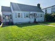 2-Bedroom Cape in the Village of Manorhaven featuring living room w/fpl, dining room, kitchen, and full bath.