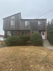 IDEAL for a CASH Buyer or CREATIVE FINANCING. Welcome to 295-297 Pelham Road in New Rochelle. This 2-Family easily lives as a 3 Family. Each Triplex Unit has a private entrance, 3 Bedrooms, 1 full Bath, 2 half Baths and private laundry. Both Units offer Kitchen with Breakfast Bar, Living Room, Dining Room and half bath b on first level. 2 Bedrooms, 1 full bath, and 1 half bath on second floor and a Spiral Staircase leading to third Bedroom. Finished lower level, adjacent to the garage, offers future opportunity for a one-bedroom apartment. Parking for 6 cars including 2-car attached garage. Excellent location close to schools, shops, beach clubs, entertainment and more.