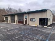 3200 sf renovated free span insulated building on 1.8 acres in the Town of Hamptonburgh Industrial (I) zone. Three (3) 12 ft and One (1) 10 ft overhead drive in doors w/automatic openers and fenced in rear yard (can drive straight thru the front and out the back). Renovated in 2020. Reception area w/full bath and 2 separate offices w/central A/C. The entire building has high efficient Radiant floor heating system run by natural gas (including the garage/shop area). Very clean garage/shop area with a 1/2 bath. Previously used as a Fedex Route hub and maintenance facility for delivery trucks. Neighboring properties currently being developed for warehouses. Adjacent and rear 14.2 acres of vacant land zoned Industrial to accomodate 100, 000 sf + warehouse (no Town approvals now) also for sale for $2, 225, 000 and can be offered as a package.