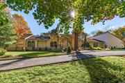 Newly renovated cedar and stone ranch is located at the end of a cul-de-sac on a magnificent gated street. It resonates a feeling of serenity, clarity and light as each and every window takes in the entire expanse of the landscape. Richly appointed with oak flooring, soaring ceilings, an open floor plan and windowed walls. The layout features a sunlit eat-in kitchen, dramatic great room and inviting den that share a dual fireplace and formal dining room. In addition there is a prep kitchen and a separate wing that is ideal for long term guests or a home remote office. Coveted primary suite with luxurious marble bathroom and study. There are four additional bedrooms. Three plus acre property boasts an entertainment complex with an in-ground pool, tennis court and a fabulous covered portico. Golf, equestrian trails, the beach, the Tilles center for the performing arts and the famed Americana shopping center are conveniently located nearby. Only 25 miles from NYC. Jericho School District.