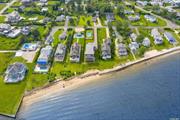 Open bay with your own sandy beach, the most glorious, all encompassing Shinnecock Bay views. In the charming Hamlet of East Quogue, situated in the Hampton Point Beach community. Four (4) bedrooms, (3) full baths, a huge kitchen with seating around the marble island, open to the living space and dining, and a wood burning fireplace, just in case for those possible nippy evenings. There is a den that can double as a guest sleeping area, if needed in a pinch. A beachy summer interior with plenty of natural light through out. The screened in room is a great plus overlooking the glistening waters and the huge exterior deck. An enjoyable place to watch the 2 returning swans and the wild life and in the distance the Majestic Ponquogue Bridge.