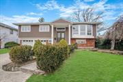 Welcome to this beautiful diamond high ranch home in North Woodmere boasting 5 bedrooms and 3 full bathrooms. High-end kitchen with stainless steel Bosch appliances that offers convenient access to the outdoor deck, an open-concept dining room that is seamlessly connected to the living room.