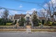 Magnificent and majestic renovated English Tudor in the heart of Jamaica Estates. There is no other property like it in Jamaica Estates(north). A true one-of-a-kind property. This breathtaking property with a huge enormous and sprawling 23, 664 sqft lot is surrounded by a stone wall that has exquisite curb appeal. This breathtaking house introduces on the lower level a full bath, gym, sauna, and steam room. The first floor introduces a large foyer with soaring cathedral ceilings, beautiful wood floors, a 1/2 bath, a large living room, a huge formal dining room, 2 dens, a beautiful sculpted fireplace, and a stunning custom-built eat-in kitchen which includes, a Subzero refrigerator, Viking stove, wolf stove top, granite countertops and top of the line cabinetry The second floor introduces 5 large and majestic bedrooms, each with a full bathroom. The master suite has a beautiful wood-burning fireplace. The third floor introduces a large sweeping bedroom. This superb property includes beautifully landscaped gardens, flower beds, shrubbery, and a cobblestone patio.2 car attached garage and 2 car detached garage.