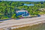 North Shore beach life awaits just 50 miles from NYC. This home offers 180&rsquo; of stunning waterfront, private beach and a pond with dock access. Beautiful, very private setting just minutes from parkways, Huntington and Northport villages. This is a setting you must see to believe.