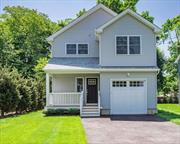 Beautifully appointed Colonial located in Huntington Village. Oak Floors, custom millwork and moldings. Spacious eat-in kitchen, adorned with stainless steel appliances, quartz countertops, and ample cabinet space. The open floor plan boasts wood floors throughout, creating a warm and inviting ambiance. The living room features a gas fireplace, perfect for creating a focal point in the heart of the home. A formal dining room provides an additional space for entertaining. The Master Bedroom suite offers a customized walk-in closet and a full bath for a private oasis within your own home. Three bedrooms and a full bath complete the second floor. The basement, with high ceilings and an egress window, provides versatile space for recreation or additional living areas. Situated in a prime location between Huntington Village and the Huntington Train Station, convenience meets luxury. Enjoy the vibrant atmosphere of the village and seamless access to transportation. Energy Star Appliances further enhance the sustainability and efficiency of this exceptional home.