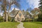 Now&rsquo;s the time to take a look at this light and airy English Country house designed by the acclaimed architect George Root in the renowned Bronxville School district....it&rsquo;s a very special new offering. 3 Westway is beautifully sited on almost a full acre of level property in an estate-like neighborhood of equally exquisite homes. The exterior shows off handsome stonework, magnificent chimneys, a heavy slate roof and expansive leaded windows flooding every room with light.  The beautiful interior is defined by a handsome oak paneled foyer which introduces a step-down living room with barreled ceiling, a handsome fireplace and expansive leaded windows.  A sun-filled home office or den is adjacent to the living room and opens to a large bluestone terrace, garden and lawn. A most charming and cozy pine paneled family room with corner fireplace and french doors also leads to the terrace. A gracious family dining room as well as delightful breakfast room open to a sleek and modern Cook&rsquo;s kitchen and pantry. A homework room or playroom is proximate to the kitchen.... a convenient back stairway as well as 2 pretty powder rooms and entrance to the heated garages complete the first floor. A magnificent oak stairway leads to plenty of bedrooms and modern baths including a spacious master suite with two walk-in closet and a serene master bath with his and her water closets with sinks, a soaking tub and shower.  The 2, 000 sf lower level features a terrific playroom with fireplace, a gym, a wine cellar, laundry, powder room and house mechanicals. In addition, there is a detached, architecturally complemented two car garage creating garaging for five cars as well as plenty of extra space-plenty of room for a golf simulator? This magnificent, well-maintained residence with its beautiful, expansive property offers a wonderful balance of gracious living in an exceptional setting for entertaining without sacrificing any comforts of a warm family home.