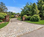 This all brick grand colonial in a prime location in the Village of Old Brookville was custom built with the foresight of having two primary bedroom suites, one on each floor. A private separate wing on the 1st floor is dedicated to an entire suite with music room or den, large bedroom and lux bathroom. The property is situated on 3.19 acres at the end of a cul-de-sac and positioned among some of the most notable estates on the North Shore of Long Island. Gated entry with belgian block apron starts you towards a sweeping driveway, front courtyard, and 3 car garage with a basketball area. A palatial two-story entrance foyer with bridal staircase immediately captures your attention and sets the tone for the luxurious features that unfold throughout the home. Over 8, 400 square feet of living space on the 1st and 2nd floor, the principal rooms are all spacious with 10&rsquo; high ceilings. Gourmet kitchen with radiant heat and top appliances, eat at the center island or sun-drenched breakfast room. Natural gas heat and gas cooking. Relax in the garden sun room. Secondary stairs lead to a professional home office quarters with multiple desks and half bath. Second floor offers another primary bedroom wing with en-suite bath and huge closets plus well proportioned three additional bedrooms all with en-suite baths. An elevator services all three levels including the full size basement with outside entrance. The lower level basement is the full size of the house, has a Gym, Sauna, Game room, Wine Cellar, Movie Theatre, and plenty of storage. The backyard is serene and park like, dressed with expansive blue stone patio and a large spa hot tub. Peaceful setting just 25 miles to Manhattan and quick trip to the Expressway and international airports. North Shore School District and Glen Head Elementary. 11545 zip code. Nearby Private Schools, just down to street from the Green Vale School and easy access to major roads and shopping at the luxurious Americana Manhasset. Enjoy the North Shore lifestyle which includes close proximity to numerous golf and tennis clubs, nature preserves, bicycle trails, Youngs Farm, Rottkamp Farm and more. This newer estate home combines classic architecture with modern amenities and tasteful appointments. Come to view and be just the second owner of this impressive residence in Old Brookville, NY.