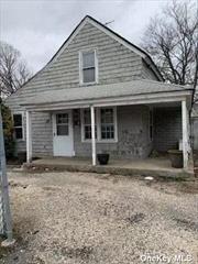 Large residential/mixed use lot in the heart of Carl Place. 2 Bedroom cottage in poor condition.  Great location to build your new construction or possible commercial use building with zoning approval. Home is grandfathered on lot as per town. Lot is zoned commercial B