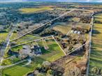 On the Main Road, in the charming Hamlet of Jamesport, is 55+ acres of Suffolk County preserved organic farmland with prime Long Island soils. Currently home to a certified organic vegetable, fruit, and flower farm, as well as an enchanting hardwood forest, this DRS farm is set up with two deep fully operational wells; an open-air storage barn; refrigerated cold storage; greenhouses; distributed underground irrigation, underground electricity, and 8-ft. deer fencing - all across 20 acres. This farm sits in the coveted Rural Corridor zoning with high visibility road frontage for your business.