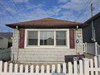 Excellent condition 2 bedroom, 1 full bath easy-living bungalow on quiet block in Inwood.  Flood insurance approximately $1200/yr and transferrable.