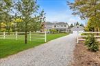 Just 2 blocks from historic Hortons Point Lighthouse & LI Sound, this exquisite 3800sf Nantucket style home, a 1900s farmhouse redesign, is set back 180&rsquo; from road. Mahogany front porch surrounds double entrance w/views of beautiful, perennial garden & hydrangeas. Entering, you&rsquo;ll find a spacious foyer, living room, & private office. French doors lead to gorgeous stone patio, huge exotic wood deck, fire pit. Expansive first floor main suite w/huge walk-in closet & newly remodeled large en suite bath w/Carrera marble, soaking tub & shower. Second floor offers 3 generous bedrooms w/plenty of closet space, full bath, & sitting area w/balcony overlooking living room. The home features HW floors & custom woodwork throughout. Spacious farmhouse kitchen w/huge center island provides views of meticulously landscaped backyard. Formal dining room just off kitchen for entertaining. Expansive private yard, w/room for pool and distant farm views, is a secluded sanctuary.