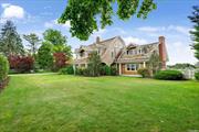 Located in the highly desirable estate section of Quogue Village, this charming bayfront home offers amazing water views, the ability to dock a boat, and launch a paddle board or kayak. The bayside gunite pool and patio is the perfect spot to take in the views and enjoy the ocean breeze. The covered front porch provides a quiet area to read a book or enjoy a cool drink. Enter the inviting foyer and see the lovely wood detailing throughout the home. A generously sized living room with a wood-burning fireplace offers the perfect gathering spot. The formal dining room includes a wet bar for entertaining. A light-filled kitchen with its own entrance, includes a spacious island, cozy breakfast area, and a charming fireplace. New top-of-the-line appliances await. A family room with a powder room completes the first floor. The second floor boast a spacious primary suite with French doors out to a balcony overlooking the bay. A junior primary en suite, plus three guest bedrooms, hall bath, and a second family room complete the upper floor. The third floor is home to a guest bedroom and bath. Conveniently located close to the Village stores and the residents-only ocean beach.