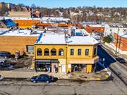 10, 000+ sq. ft. 2 story brick corner mixed use property located at East 3rd St. & S. Columbus (Rt. 22). 6 ground fl. commercial spaces with 4 spacious residential units on the 2nd fl., & a large basement. 8.9% CAP RATE. The retail stores include a barber shop, salon, deli, restaurant (2 fronts) and an office. The office will be vacant at closing. The 4 residential units consists of 2 3BR/1B and 2 2BR/1Bath units. 1 3BR and 1 2BR are vacant presently and available to show. They were recently renovated with new kitchens including stainless steel appliances & wood cabinets. The renovated bathrooms include new vanities and marble tiles shower walls. All commercial (modified gross) and residential units have their own gas and electric meters. The residential water expense is paid by the landlord while commercial tenants pay an additional $100 or $125 monthly. Property video, lease summary & P&L preform available. Building analysis under current. Zoning analysis and rent roll attached.