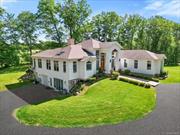 Welcome to this elegant and well crafted contemporary home situated on 2.8 acres in the Shawangunk area featuring over 6, 500 sq. ft. Immerse yourself in the natural light that abundantly overflows this home. Walking into the main level, you will be captivated by the soaring tray ceiling, expansive Anderson windows, double sided wood burning fireplace and a spacious open concept w/french doors leading out to the covered patio. Unwind by the fireplace in the living room and be delighted as the equinox/solstice transition every season as the landscape outside magically transforms before your eyes. Entertain guests in the chef&rsquo;s gourmet kitchen which seamlessly flows into the dining room, living room, or breakfast bar island while overlooking the panoramic views. Includes: Waterfall kitchen island, Bosch stainless steel appliances, double wall ovens, food warmer, and wine chiller. After a long day, whisk yourself into the first floor primary suite that has soaring tray ceiling, ensuite bath, deep soaking tub, eco friendly fireplace, walk-in tiled shower, enormous walk-in closet, sitting area, and doors leading to your private terrace with a hot tub for a spa-like experience. The total living area on main floor is 3, 520 sq. ft plus an additional 3, 000 sq. ft. on the lower level (consisting of 2 large recreational rooms, sitting rooms, storage rooms and wood burning stove) with a private entrance. The detached 3 car garage is over 1, 000 sq. ft, equipped with a car lift, wood burning stove and a workshop. Home is wired interior & exterior for the security system and a multi-zone audio music surround sound system with built-in speakers on the main entertaining level. This home runs on an energy efficient system with 3 zone radiant heated floors and 3 zone central air conditioning on the main level; foam insulation throughout & all garages. Electrical panel wired for a generator. The outdoor covered patio area is 350 sq. ft and is foam insulated w/built-in BBQ & bar w/sink. This property provides a tranquil & serene lifestyle surrounded by meadows, flowering trees, and open fields.  Minutes to wineries, orchards, Mohonk Mountain House, Minnewaska State Park. Make this luxurious retreat your home or weekend escape.