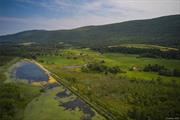 Boston Corners Farm. Estate parcel with incomparably beautiful panoramic views of the Upper Harlem Valley. Conveniently located near the trend setting Hamlet of Millerton NY. Views are almost entirely protected by federal, state and Columbia Land Conservancy properties that make up the Berkshire Taconic Mountain Range and the Harlem Valley Rail Trail Corridor. Walk, bike or drive to Bash Bish Falls, Catamount Ski Area, Hudson, Great Barrington and all the outdoor recreational, artistic, and cultural amenities that make the greater Hudson Valley region one of the most strategically sound and enjoyable place to live in the Western Hemisphere. Rarely does an opportunity such as this present itself.