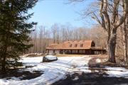 Set proudly into a private, forested 2.8 acres of pristine Windham real estate. Original loft house of the Mt Pisgah Estate, 2005 square feet, 3 bedroom, 2 bathrooms with vaulted second story Great Room. Grand wood burning stove acts as the centerpiece of living, dining and entertainment in this vintage open and spacious floor plan. Oversized 2 Car Garage with separate entrance and access to finished guest space. Dutch architectural roof with skylights, oversized deck overlooking brook. Whitewater creek, access to hiking trails, hunting, fishing, views of Windham Mountain. Elevated and built into cleared landscape with long private driveway, parking for 10+. Low Taxes! This is your great northern Catskill Mountains getaway opportunity!