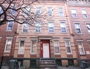 Six family townhouse with two 2 bedroom, 1 bath apartments on each level. Lots of potential!! A block away from the M train, Seneca st. station. Sold as is.