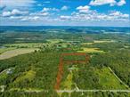 On top of Silver Mountain is this 6.11 acre flag lot with an elevation of 1400 feet. Located on a picturesque Dutchess County road, this property features a pine grove forest with a clearing. Build your dream home in this peaceful and private setting. Situated between Millerton and Pine Plains, and just 15 minutes to the Metro North Train Station in Wassaic.