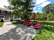 Fully renovated in 2020, this two-story cedar shake home in East Quogue is the perfect summer rental! Open living/dining concept with a kitchen that boasts custom shaker cabinets, quartzite countertops, and stainless-steel appliances. The second floor includes the primary suite with cathedral ceilings, double walk-in closets, and a luxurious bathroom. A junior primary suite, two additional bedrooms, and a second-floor laundry room complete the layout.  The garage has been transformed into a wellness haven with a newly added gym and sauna, offering a convenient and private space for your fitness routine. Meanwhile, the basement is furnished an additional bonus room/office space, perfect for those working from home.   The outdoor space includes a brick patio, fire pit, a fenced-in yard, and an in-ground pool with spa perfect for all your summer activities. Just minutes away from nearby beaches and the village of Westhampton Beach that has all the restaurants and shops you will need.