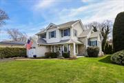 Welcome to this beautiful three-bedroom, two-and-a-half-bath Colonial retreat just a stroll away from the beach and park. Beyond the inviting entry foyer lies a meticulously maintained residence boasting laminate wood floors and bespoke window treatments in the Living Room and Dining Room. The Family Room, featuring a vaulted ceiling and a dual-sided gas fireplace connecting to the Dining Room, offers a splendid ambiance with oversized windows and a sliding door leading to the patio. Enjoy the modernized eat-in kitchen equipped with cherry cabinets, Silestone countertops, stainless steel appliances, a skylight, and another sliding door to the patio. The Laundry/Mud Area, with outside entry , adds practicality to the space. The Primary bedroom impresses with its vaulted ceiling, gas fireplace, balcony, and custom walk-in closets. Embrace outdoor living on the wrap-around front porch or the stone patio in the private fenced backyard surrounded by lush landscaping. Convenient features include a custom-built shed, a spacious driveway, central air, a new hot water heater with a Weil McLain Boiler, three fireplaces, inground sprinklers, solar panels, and inside entry from the attached garage-Low taxes! This residence is a harmonious blend of comfort, style, and practicality.