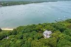 530ft Private Beach Frontage frames this Timeless and Elegant Property, with the most water frontage in Belle Terre makes it the ultimate gem of Belle Terre.  This Historical Estate, originally built for Ralph Peters in 1906, has been stunningly renovated to showcase the original details complete with all today&rsquo;s modern necessities.  The almost 6000 sqft home features tremendous architectural beauty, plenty of outdoor seating areas, with access to your own private beach.  The interior of the house is a perfect marriage of character and grandeur, with old charm seamlessly mixing with modern design. The main floor boasts a 2 story Grand Room, a central hub of elegance that ties all the main living spaces together, and is wrapped by a stunning enclosed porch. 2 levels of luxury offer 8 bedrooms and a vaulted Family Room.  The grounds are so large they can be subdivided creating enough room for a second 1.36 acre estate with direct beachfront access.  Call for a private showing.