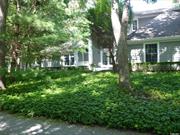 Striking Ten-Room, Five-Bedroom, Four-Bath Post-Modern Gem nestled astride a verdant Nature Reserve on 1.5 acre property. Featuring a Heated Salt Water, 20x40 In-Ground Vinyl-Lined Swimming Pool, just steps away from a Gunite Hot Tub, Gardens, Paths, and Inviting Nooks. The Main floor features a Sunny Cathedral-Ceiling Living Room, a Separate Dining Room, Bar, and Eat-In-Kitchen, as well as Primary and Secondary Bedrooms and Two Full Baths. Upstairs, a Showcase Balcony, Three Bedrooms and Two Full Baths. The basement houses Two Fully Finished Playrooms and Copious Storage Space. All this on one-and-a-half acres of beautifully designed and landscaped property adjoining the previously mentioned nature reserve. The house enjoys a Generously-Sized Driveway, plenty of parking for entertaining, as well as a Convenient Cul-de-Sac. Close to East Hampton Village in coveted Northwest Woods.